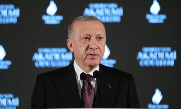 Turkish President Recep Tayyip Erdogan greets the audience at the ceremony held in Istanbul, Turkey on December 19, 2021.  (Murat Cetinmuhurdar / Presidential Press Office / Handout via Reuters)