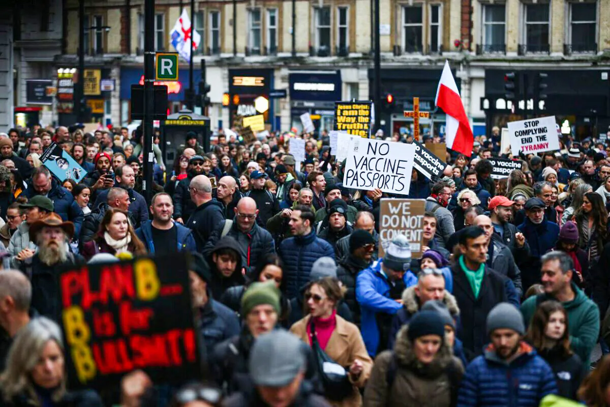 Demonstrators took to the streets against vaccine passports and lockdowns near Victoria Station in London on Dec. 18, 2021. (Hollie Adams/Getty Images)