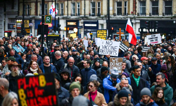 Demonstrators took to the streets against vaccine passports and lockdowns near Victoria Station in London on Dec. 18, 2021. (Hollie Adams/Getty Images)