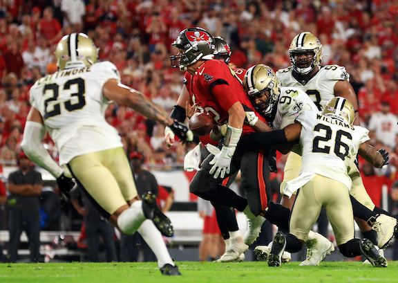 Tom Brady #12 of the Tampa Bay Buccaneers fumbles the ball as he is hit by Cameron Jordan #94 of the New Orleans Saints during the 4th quarter of the game at Raymond James Stadium, in Tampa, Fla., on Dec. 19, 2021. (Mike Ehrmann/Getty Images)