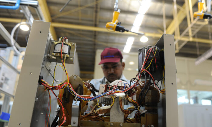 A file image of an Indian employee works at the electronics factory at Jhajjar in Haryana on Dec. 12, 2012. (Sajjad Hussain/AFP via Getty Images)