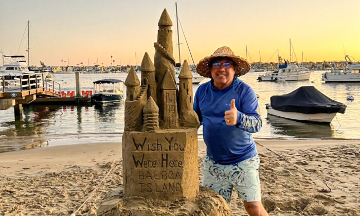 Chris Crosson next to one of his sandcastle creations. (Courtesy of Chris Crosson)