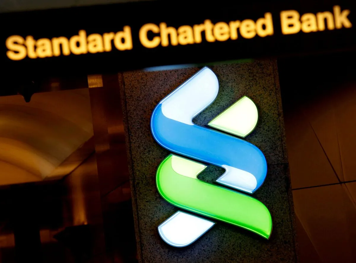 A logo of Standard Chartered is displayed at its main branch in Hong Kong, China, on Aug. 1, 2017. (Bobby Yip/Reuters)