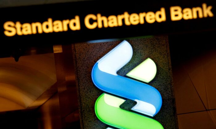 A logo of Standard Chartered is displayed at its main branch in Hong Kong, China, on Aug. 1, 2017. (Bobby Yip/Reuters)
