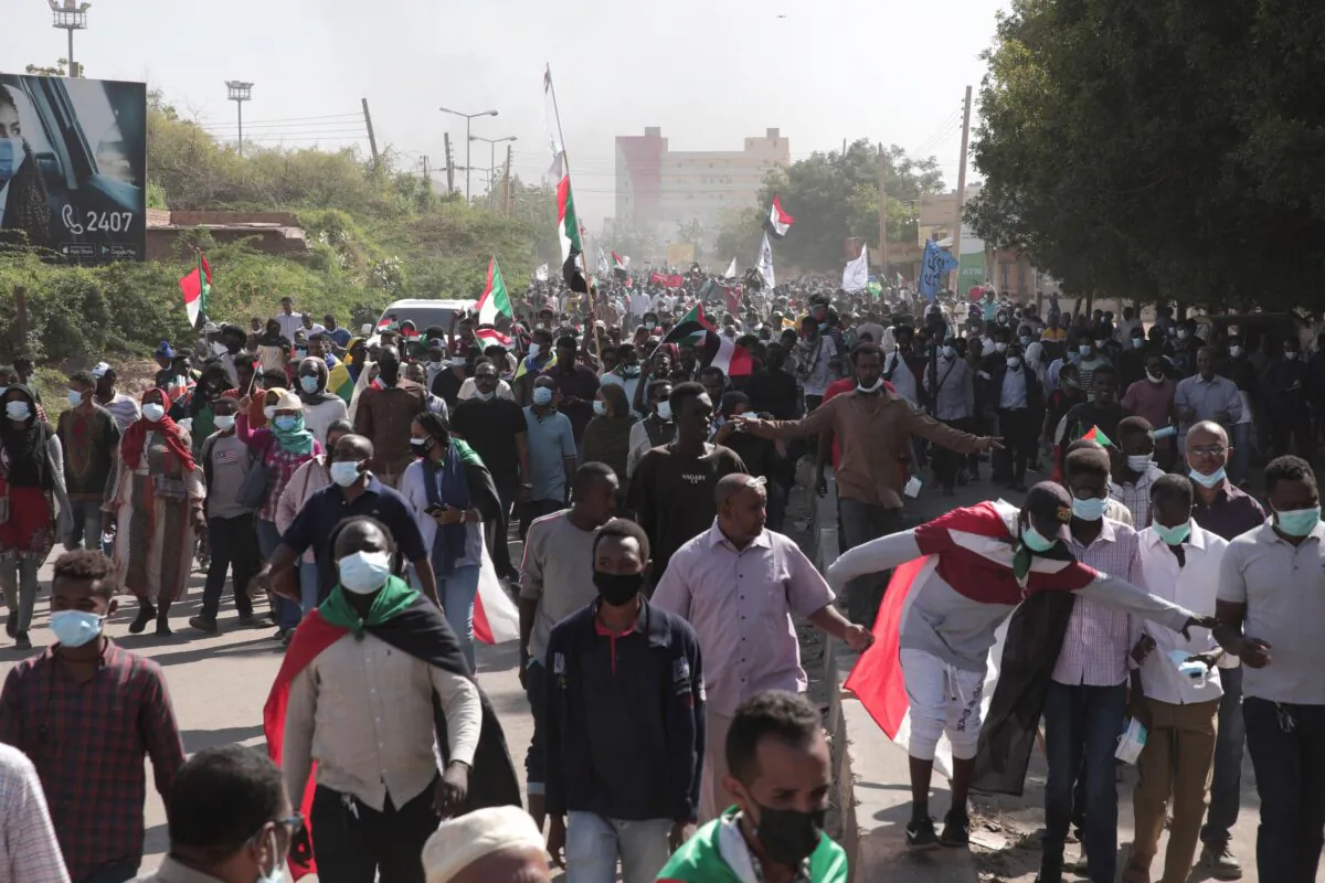 People take part in a protest against the October military takeover and a subsequent deal that reinstated Prime Minister Abdalla Hamdok but sidelined the movement in Khartoum, Sudan, on Dec. 19, 2021. (Marwan Ali/AP Photo)