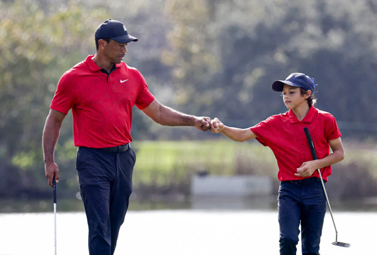 Tiger Woods and his son Charlie on the 12th hole during the second round of the PNC Championship golf tournament in Orlando, Fla., on Dec. 19, 2021. (Joe Skipper/Reuters)