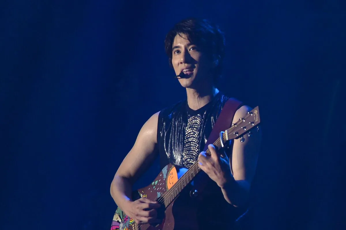 Wang Leehom, an American songwriter and singer, performs on stage during his solo concert in Nanjing, in east China's Jiangsu Province, on May 20, 2018. (Chinatopix via AP)