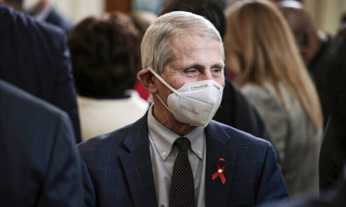Dr. Anthony Fauci speaks with people at the White House in Washington on Dec. 1, 2021. (Anna Moneymaker/Getty Images)