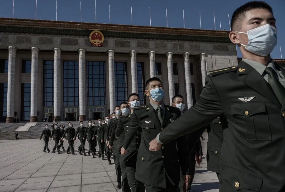 Chinese soldiers from the People's Liberation Army march after a ceremony marking the 70th anniversary of China's entry into the Korean War, on Oct. 23, 2020, at the Great Hall of the People in Beijing. (Kevin Frayer/Getty Images)
