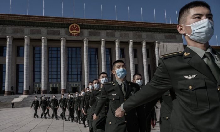 Chinese soldiers from the People's Liberation Army march after a ceremony marking the 70th anniversary of China's entry into the Korean War, on Oct. 23, 2020, at the Great Hall of the People in Beijing. (Kevin Frayer/Getty Images)