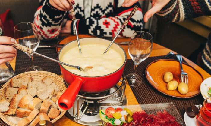 Depending on the region of Switzerland, fondues may vary in terms of the cheese or additional ingredients used, but the tradition remains firmly in place. (Anna Nahabed/Shutterstock)