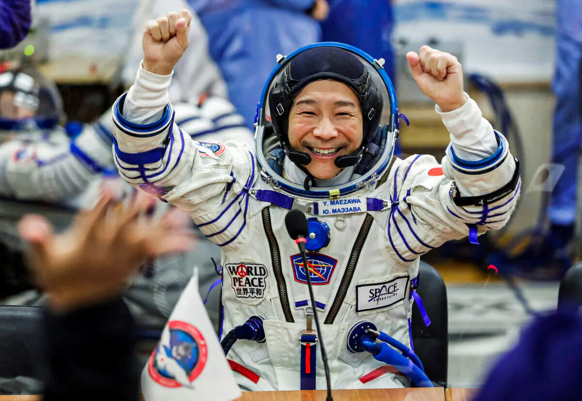 Japanese entrepreneur Yusaku Maezawa reacts as he speaks with his family after donning space suits shortly before the launch to the International Space Station (ISS) at the Baikonur Cosmodrome, Kazakhstan, on Dec. 8, 2021. (Shamil Zhumatov/File Photo/Reuters)