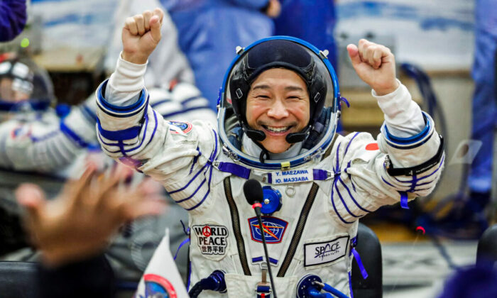 Japanese entrepreneur Yusaku Maezawa reacts as he speaks with his family after donning space suits shortly before the launch to the International Space Station (ISS) at the Baikonur Cosmodrome, Kazakhstan, on Dec. 8, 2021. (Shamil Zhumatov/File Photo/Reuters)