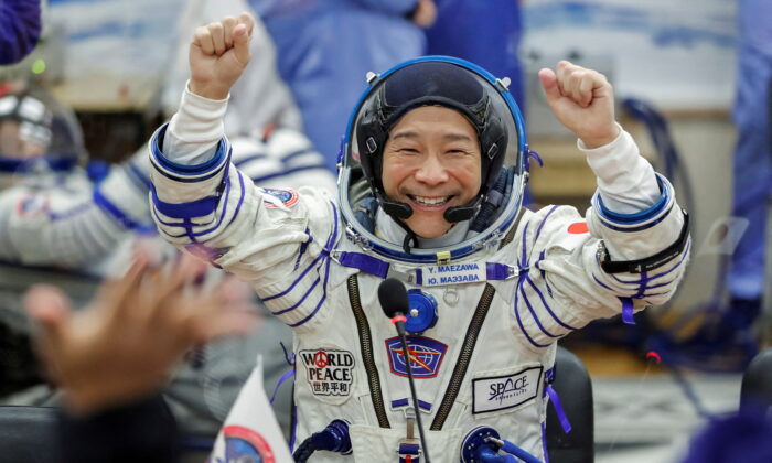 Japanese entrepreneur Yusaku Maezawa reacts as he speaks with his family after donning space suits shortly before the launch to the International Space Station (ISS) at the Baikonur Cosmodrome, Kazakhstan, on Dec. 8, 2021. (Shamil Zhumatov/Reuters)