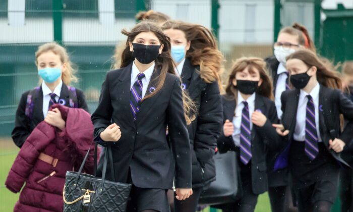 Students arriving at Outwood Academy in Woodlands, Doncaster in Yorkshire, on Dec. 20, 2021. (PA)