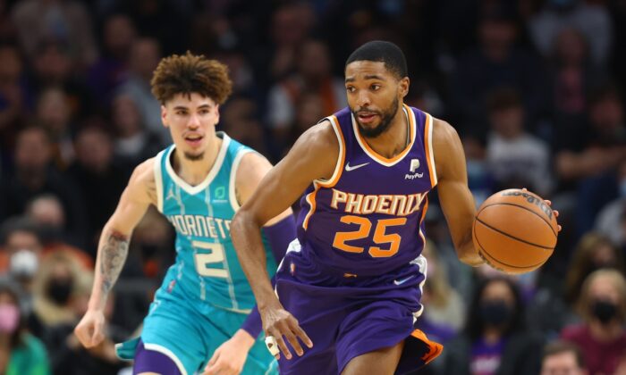 Phoenix Suns forward Mikal Bridges moves the ball against the Charlotte Hornets in the first half at Footprint Center. (Mark J. Rebilas/USA TODAY Sports via Field Level Media)
