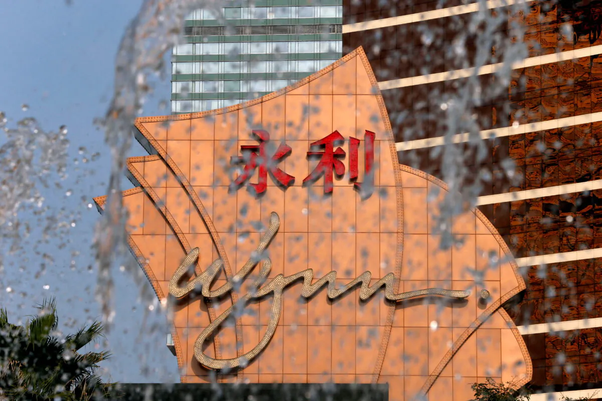 A company logo is seen behind a fountain spray at Wynn Macau resort in Macau, on Feb. 8, 2018. (Bobby Yip/Reuters)