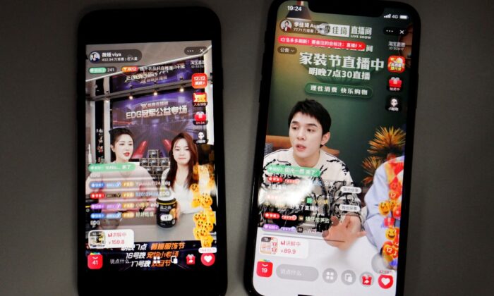 Chinese livestreamers Li Jiaqi (R) and Viya (L)  are seen on Alibaba's e-commerce app Taobao shown on mobile phones on Dec.14, 2021. (Florence Lo/Reuters)