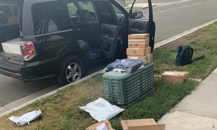 A police officer of the Anaheim Police Department recovered stolen packages for five families after a victim captured a detailed description of the suspects' car on Dec. 17, 2021, in Anaheim, Calif. (Courtesy of Anaheim Police Department)