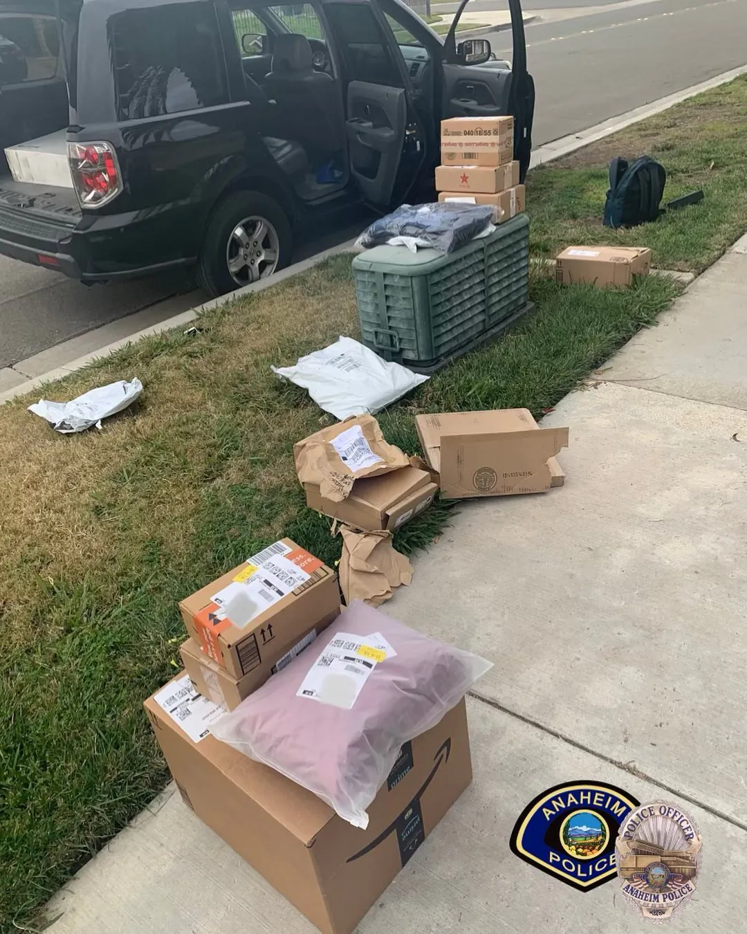 A police officer of the Anaheim Police Department recovered stolen packages for five families after a victim captured a detailed description of the suspects' car on Dec. 17, 2021, in Anaheim, Calif. (Courtesy of Anaheim Police Department)