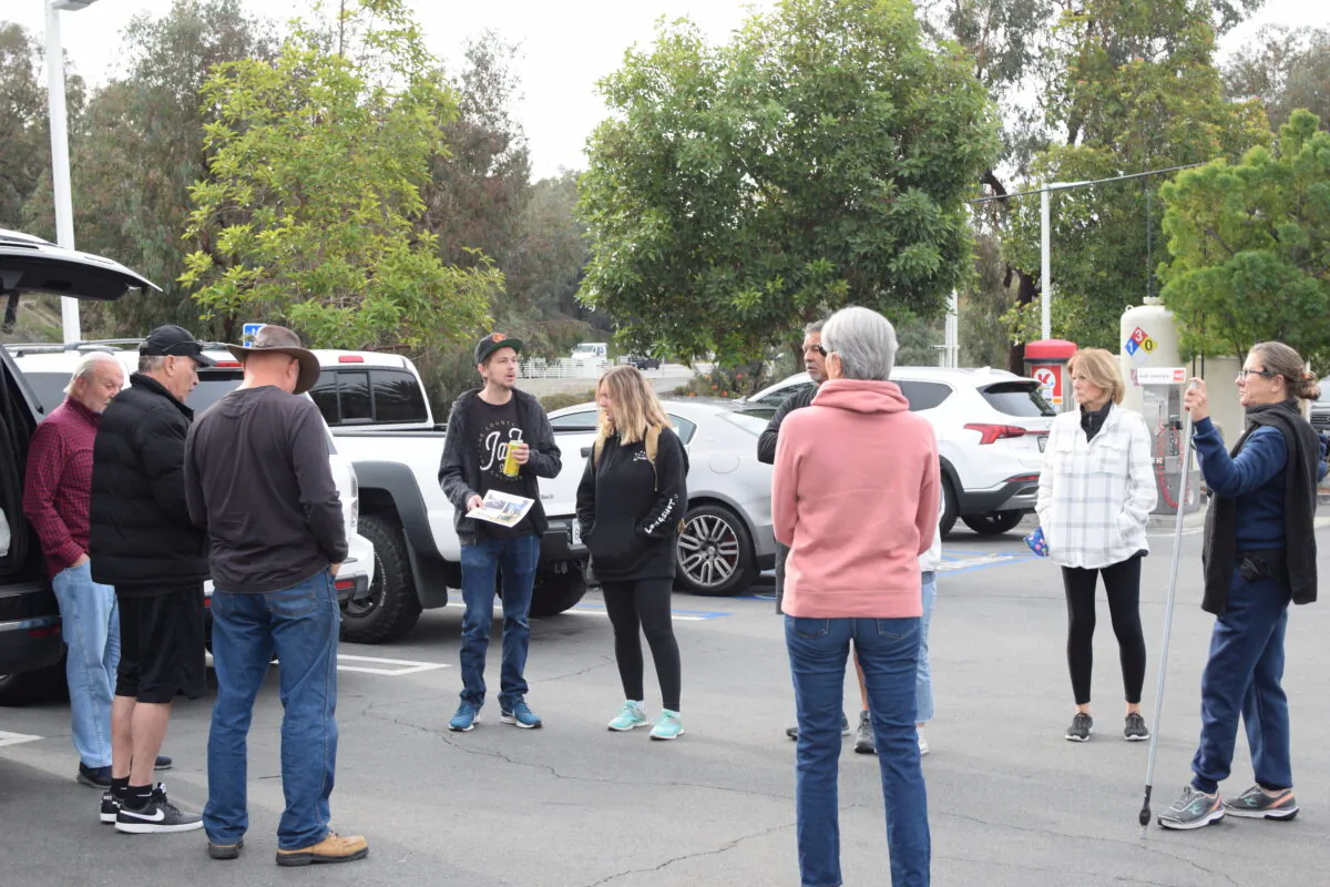 Family and friends of Scott Karsten, 60, who went missing in October, organized a search-and-rescue party in San Clemente, Calif., on Dec. 21, 2021. (Brandon Drey/The Epoch Times)