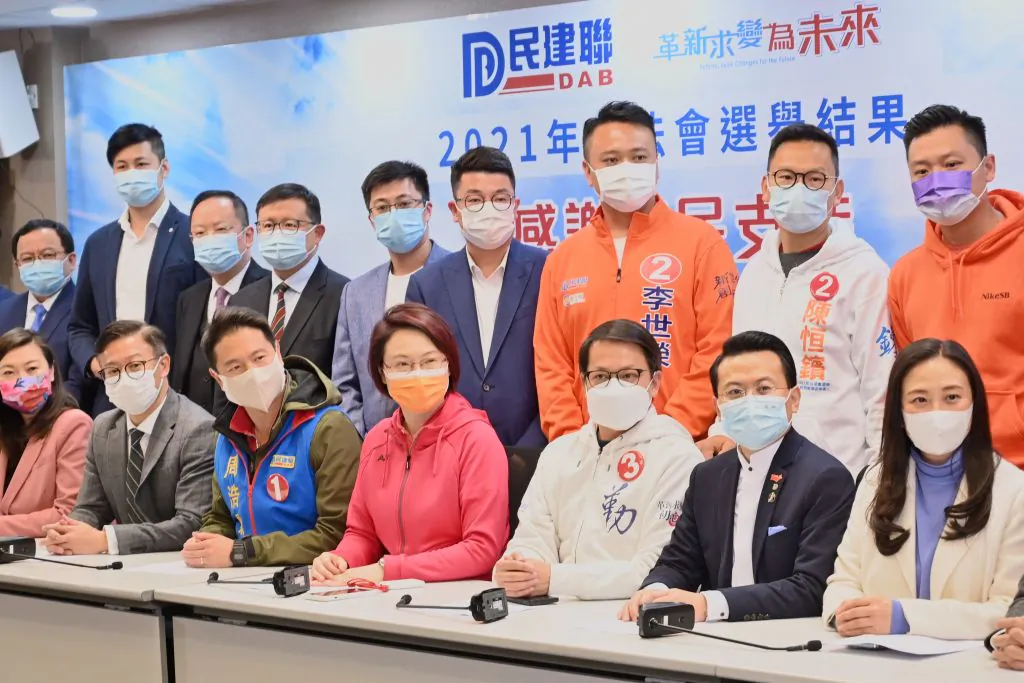 Starry Lee (bottom-C), chairwoman for the pro-Beijing Democratic Alliance for the Betterment and Progress of Hong Kong (DAB), speaks at a press conference with party members in Hong Kong on Dec. 20, 2021 as Pro-Beijing candidates swept to victory in a "patriots only legislature vote that saw record low turnout from voters and government loyalists sweep every seat. (Peter Parks/AFP via Getty Images)