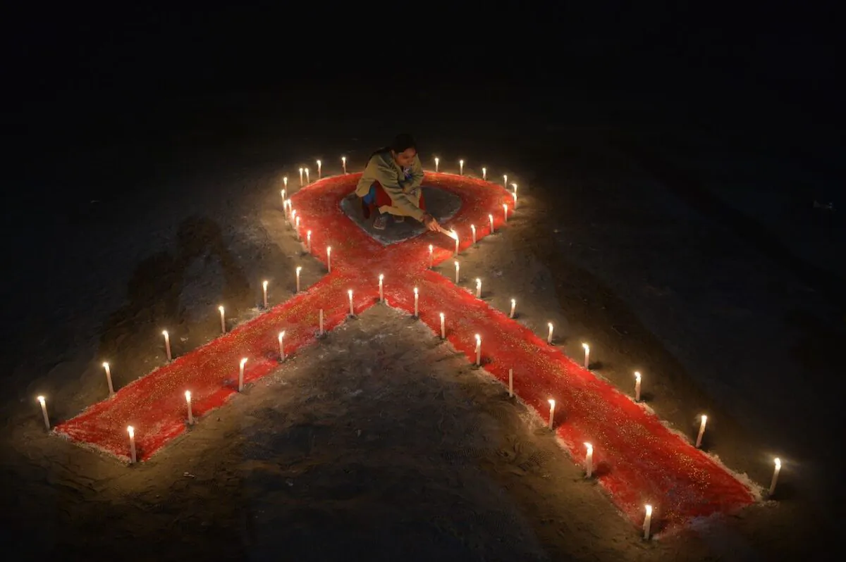 Candles form the shape of a ribbon as part of an awareness event on the occasion of World AIDS Day in Siliguri, India, on Dec. 1, 2018. (Diptendu Dutta/AFP via Getty Images)
