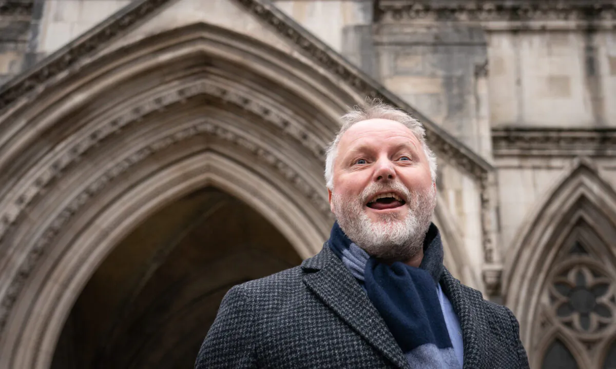 Former police officer Harry Miller speaks to the media outside the Royal Courts of Justice in London on Dec. 20, 2021. (Dominic Lipinski/PA)