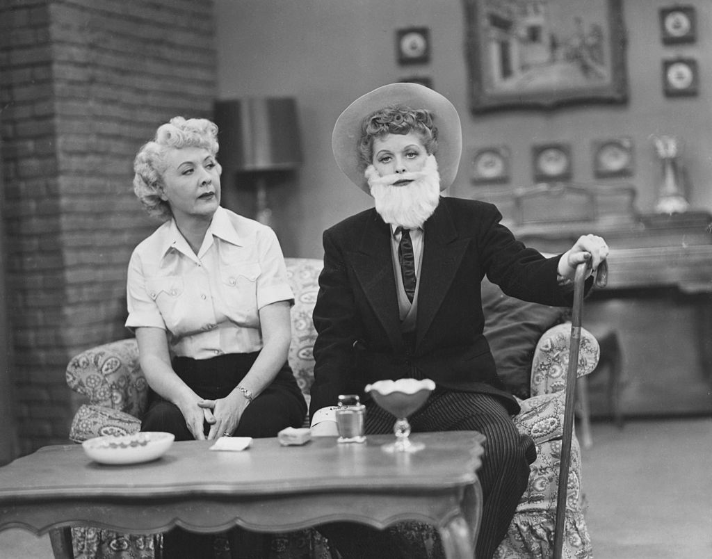 American comedienne Lucille Ball (1911-1989) wearing a false beard and a man's suit for "The Moustache," an episode of the television series "I Love Lucy," 1952. Beside her is co-star Vivian Vance (1909-1979). (FPG/Hulton Archive/Getty Images)