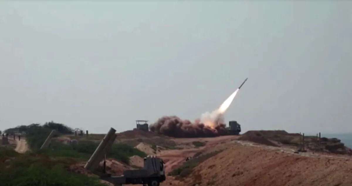 Various of missiles being launched from ground vehicles, during an Iranian military drill, at an unknown location, in Southwest Iran, on Dec. 21, 2021. (Reuters/Screenshot via The Epoch Times)