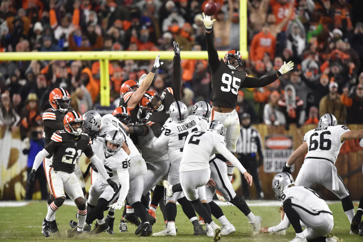 Las Vegas Raiders kicker Daniel Carlson (2) kicks a game winning 48-yard field goal during the second half of an NFL football game against the Cleveland Browns, in Cleveland, on Dec. 20, 2021. (David Richard/AP Photo)