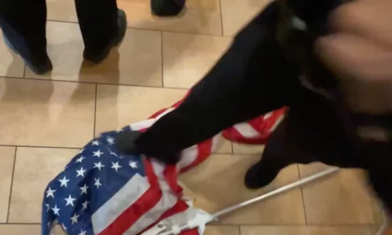 NYPD Officer Throws American Flag on Floor, Tramples It During Scuffle With Protesters
