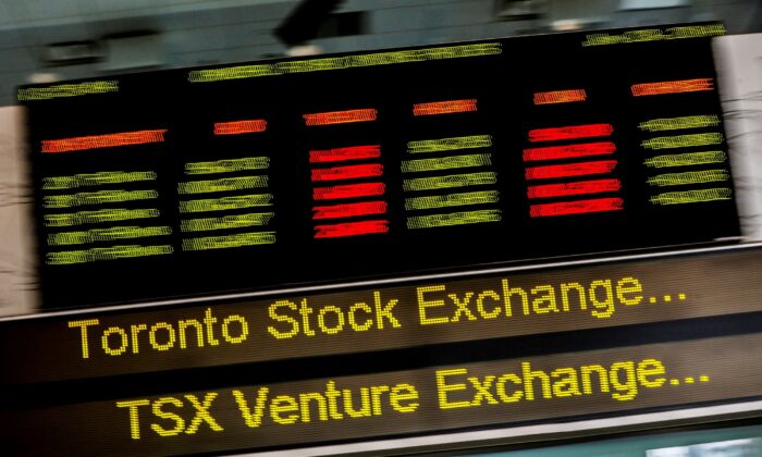 A sign board displaying Toronto Stock Exchange (TSX) stock information is seen in Toronto, on June 23, 2014. (Mark Blinch/Reuters)
