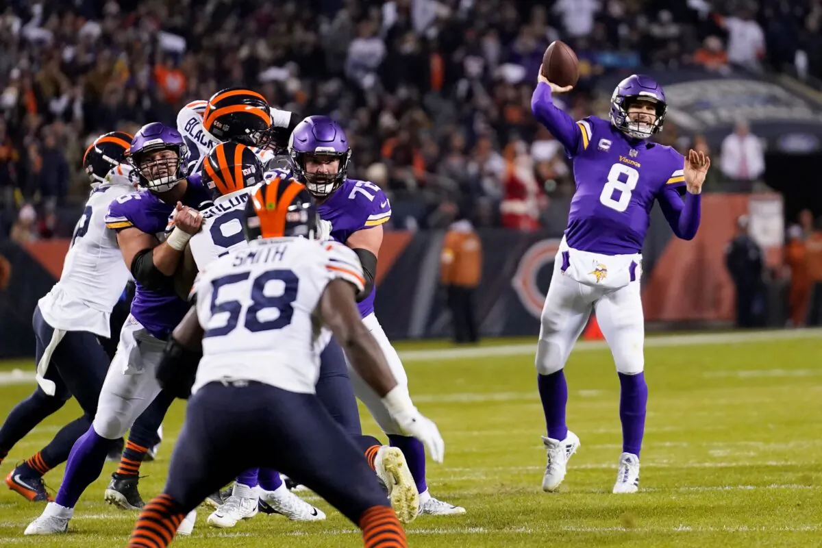 Minnesota Vikings quarterback Kirk Cousins throws a touchdown pass to Justin Jefferson during the first half of an NFL football game against the Chicago Bears in Chicago, on Dec. 20, 2021. (Nam Y. Huh/AP Photo)