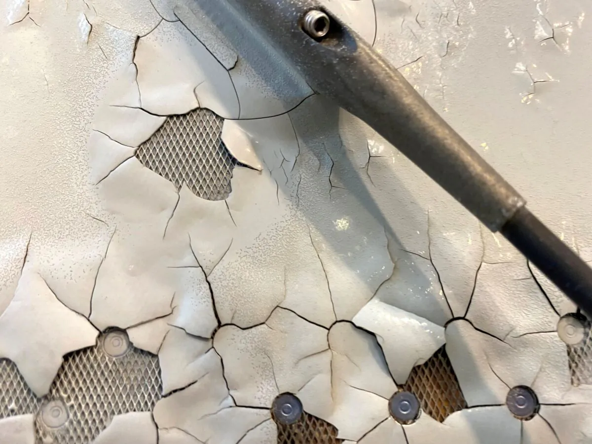 An undated image shows what appears to be paint peeling, cracking and exposed expanded copper foil (ECF) on the fuselage of a Qatar Airways A350 aircraft grounded by the Qatari regulator. (Reuters File Photo)