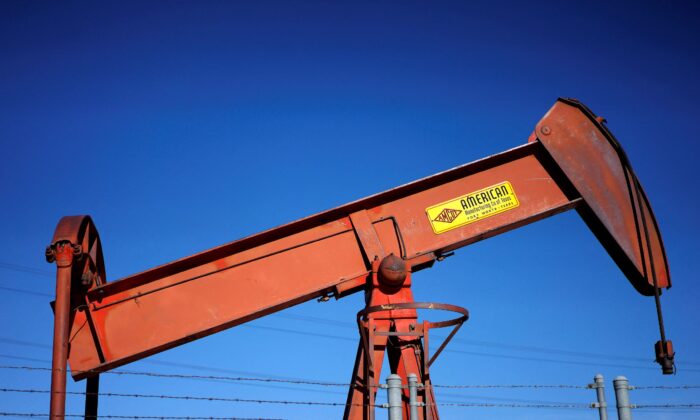 An oil well pump jack is seen at an oil field supply yard near Denver, Colo., on Feb. 2, 2015. (Rick Wilking/Reuters)