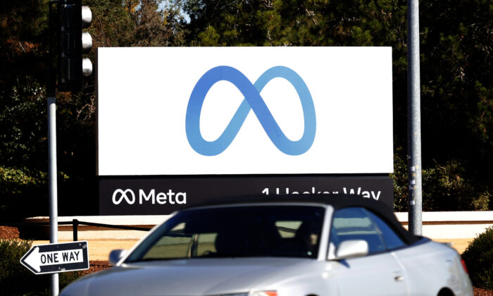 A car drives by a new logo and the name 'Meta' on the sign in front of Facebook headquarters in Menlo Park, Calif., on Oct. 28, 2021. (Justin Sullivan/Getty Images)