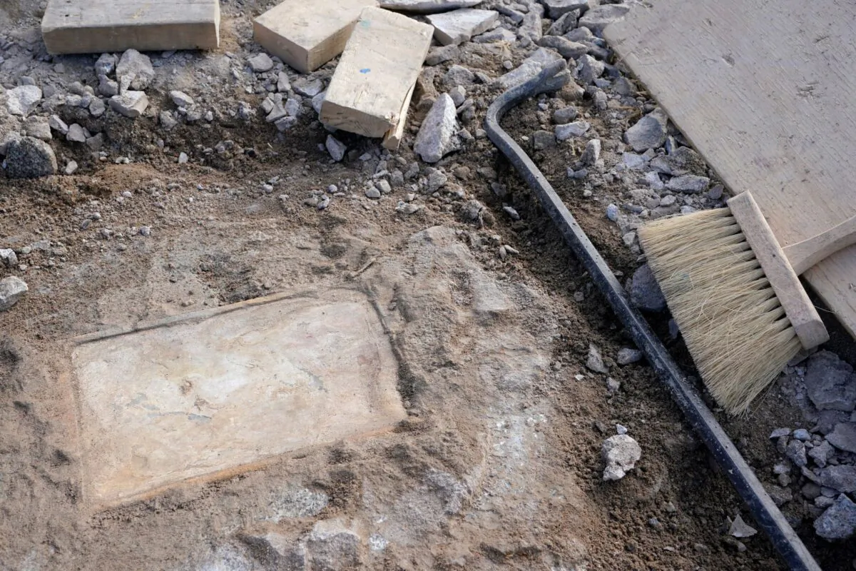 A time capsule that was placed in 1887 in the pedestal that once held the statue of Confederate General Robert E. Lee is uncovered on Monument Avenue, in Richmond, Va., on Dec. 17, 2021. (Steve Helber/AP Photo)