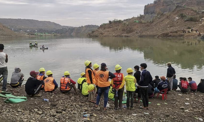 Members of the rescue team search for missing people at a jade mining area in Hpakant, Kachin State, Burma, on Dec. 22, 2021. (AP Photo)