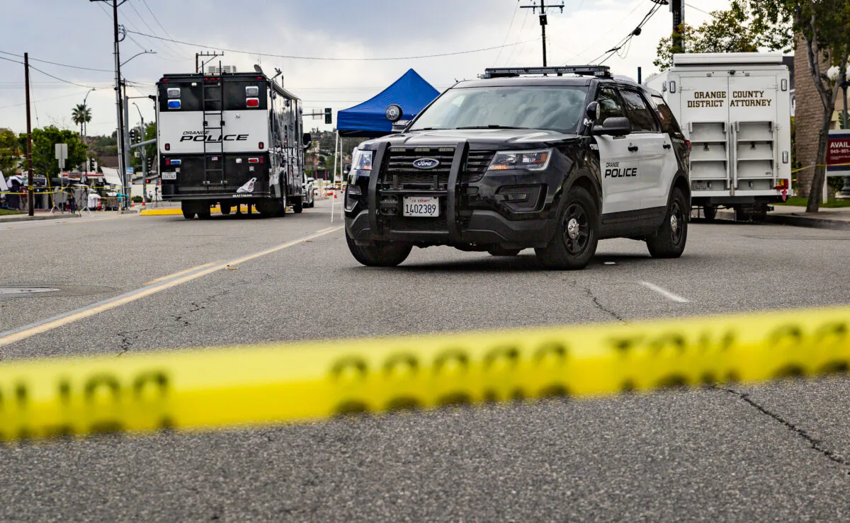 Orange Police monitor a crime scene in Orange, Calif., on April 1, 2021. (John Fredricks/The Epoch Times)