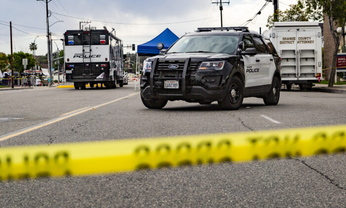 Orange Police monitor a crime scene in Orange, Calif., on April 1, 2021. (John Fredricks/The Epoch Times)