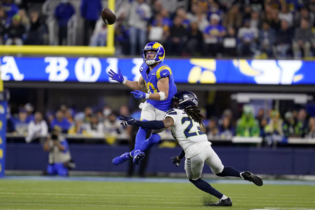 Los Angeles Rams wide receiver Cooper Kupp, top, catches a pass over Seattle Seahawks cornerback Sidney Jones during the second half of an NFL football game in Inglewood, Calif., Dec. 21, 2021. (Ashley Landis/AP Photo)