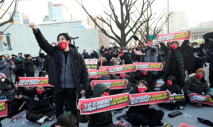 Small business owners stage a rally against the government's social distancing rules near the Government Complex in Seoul, South Korea, on Dec. 22, 2021. (Ahn Young-Joon/AP Photo)