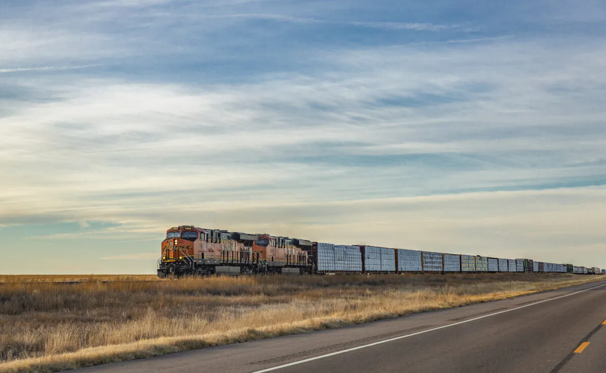 A train rides towards Amariillo outside of Dumas, Texas on Dec. 5, 2021. (John Fredricks/The Epoch Times)