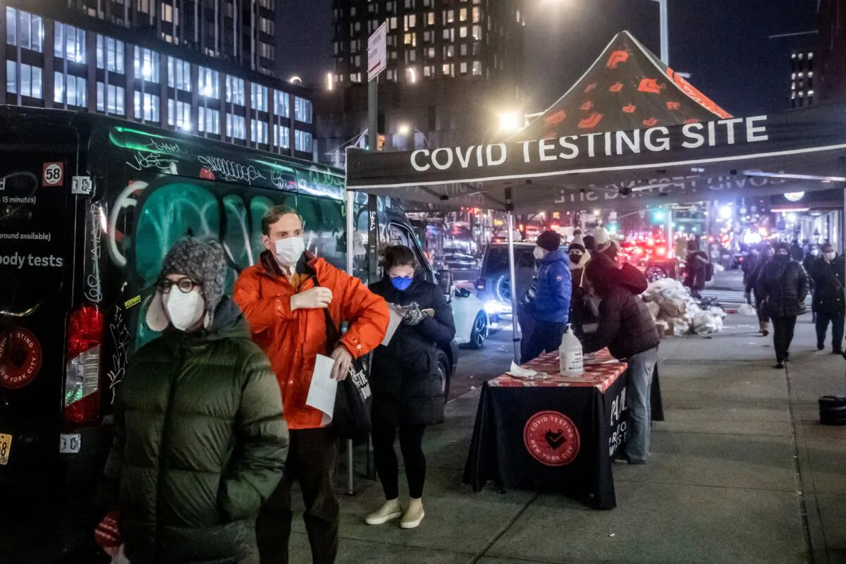 People wait on line to get tested for COVID-19 on the Lower East Side of Manhattanin New York on Dec. 21, 2021. (Brittainy Newman/AP Photo/)