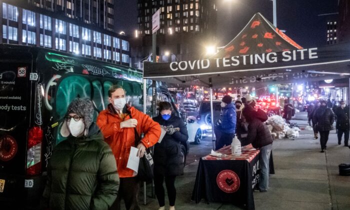 People wait on line to get tested for COVID-19 on the Lower East Side of Manhattanin New York on Dec. 21, 2021. (Brittainy Newman/AP Photo/)
