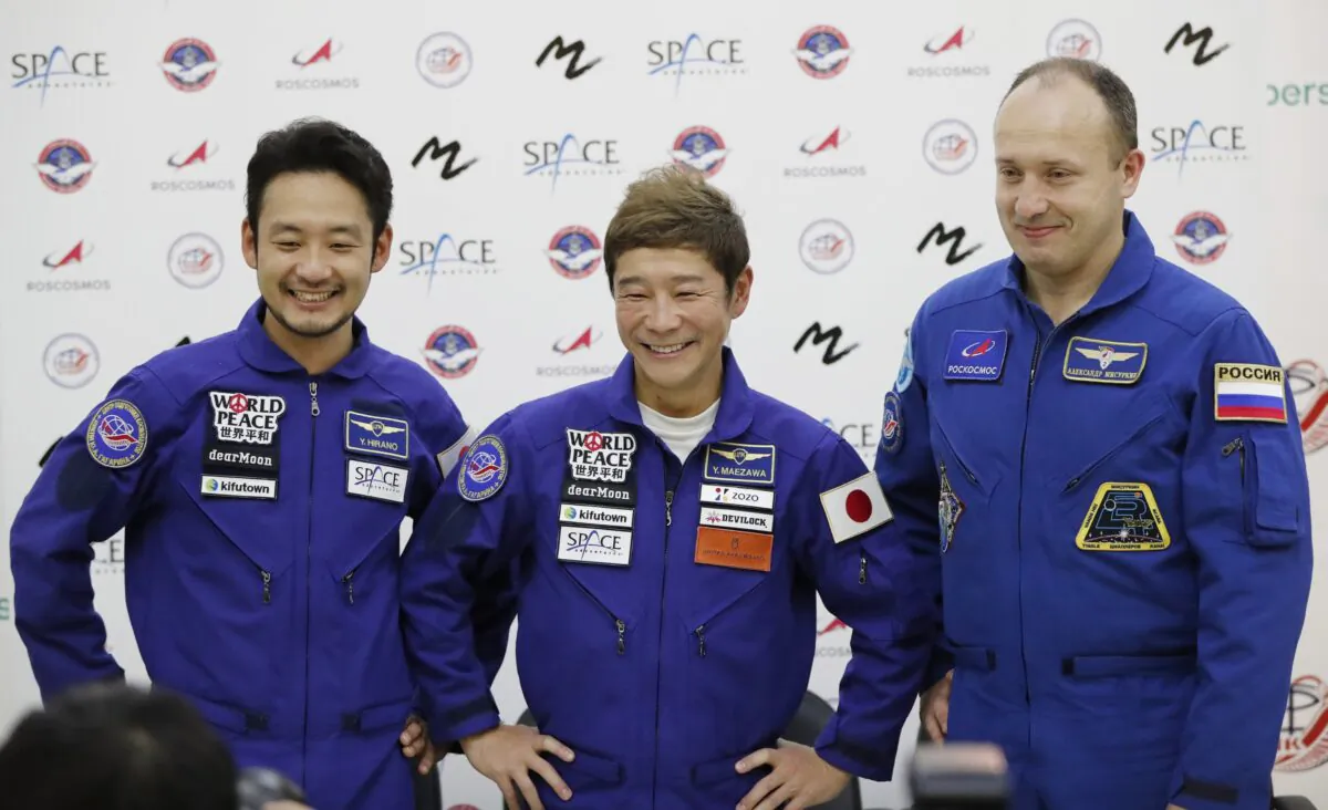 Roscosmos cosmonaut Alexander Misurkin (R), space flight participants Yusaku Maezawa (C), and Yozo Hirano attend a news conference ahead of the expedition to the International Space Station at the Gagarin Cosmonauts' Training Center, in Star City outside Moscow, on Oct. 14, 2021. (Shamil Zhumatov/Pool Photo via AP)