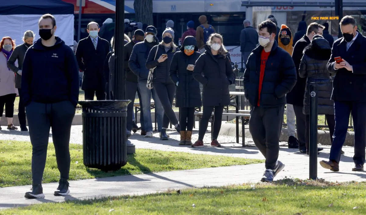 People stand in line to get COVID-19 tests in Washington on Dec. 20, 2021. (Chip Somodevilla/Getty Images)