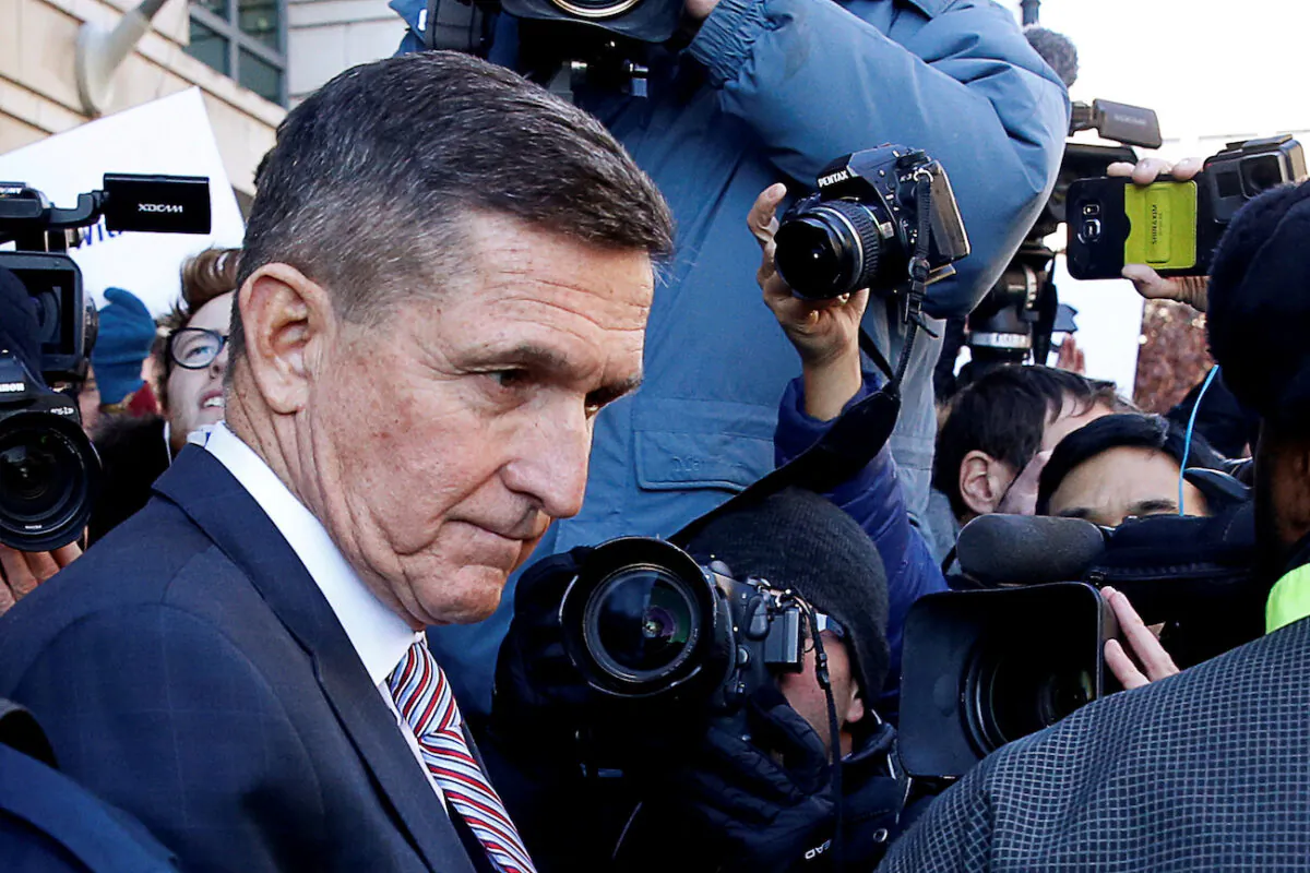 Former U.S. national security adviser Michael Flynn passes by members of the media as he departs after his sentencing was delayed at U.S. District Court in Washington, Dec. 18, 2018. (Joshua Roberts/Reuters)