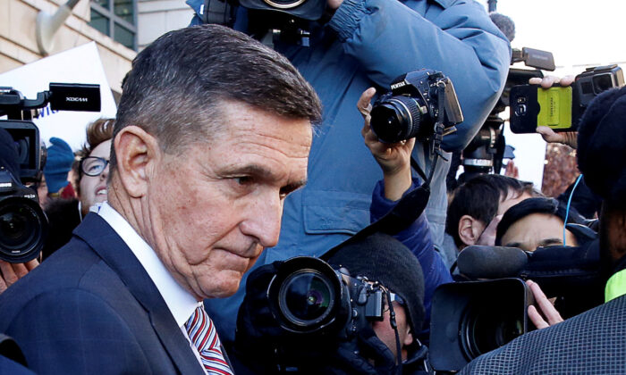 Former U.S. national security adviser Michael Flynn passes by members of the media as he departs after his sentencing was delayed at U.S. District Court in Washington, Dec. 18, 2018. (Joshua Roberts/Reuters)